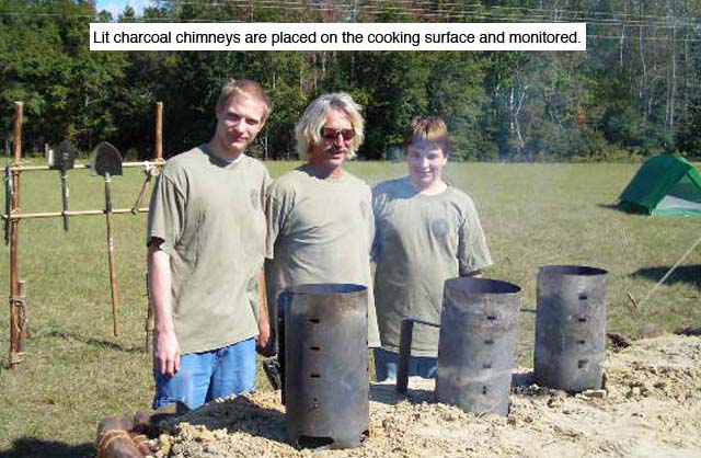 Lit charcoal chimneys are placed on the cooking surface and monitored.