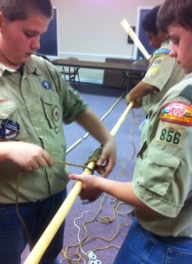 Spacing their round lashings.