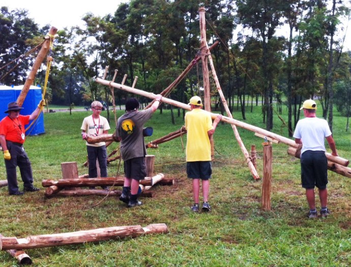 Link to: Larger Image A Boom Derrick could be placed at each corner of the log cabin construction site.