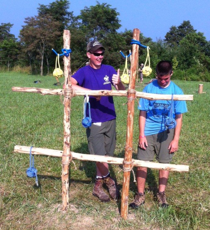 Yellow wins! Two Scouts pose after their tic-tac-toe game.